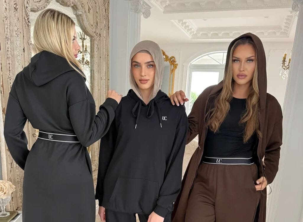 Woman wearing wide-leg modest sport pants with an oversized matching tee, styled for everyday wear.